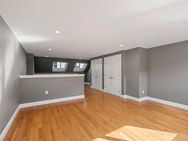 a view of a livingroom with wooden floor