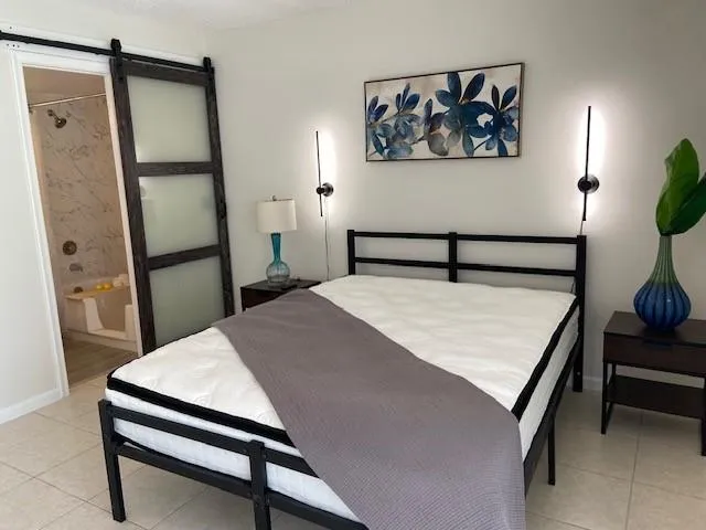 a room with a table and a painting on the wall