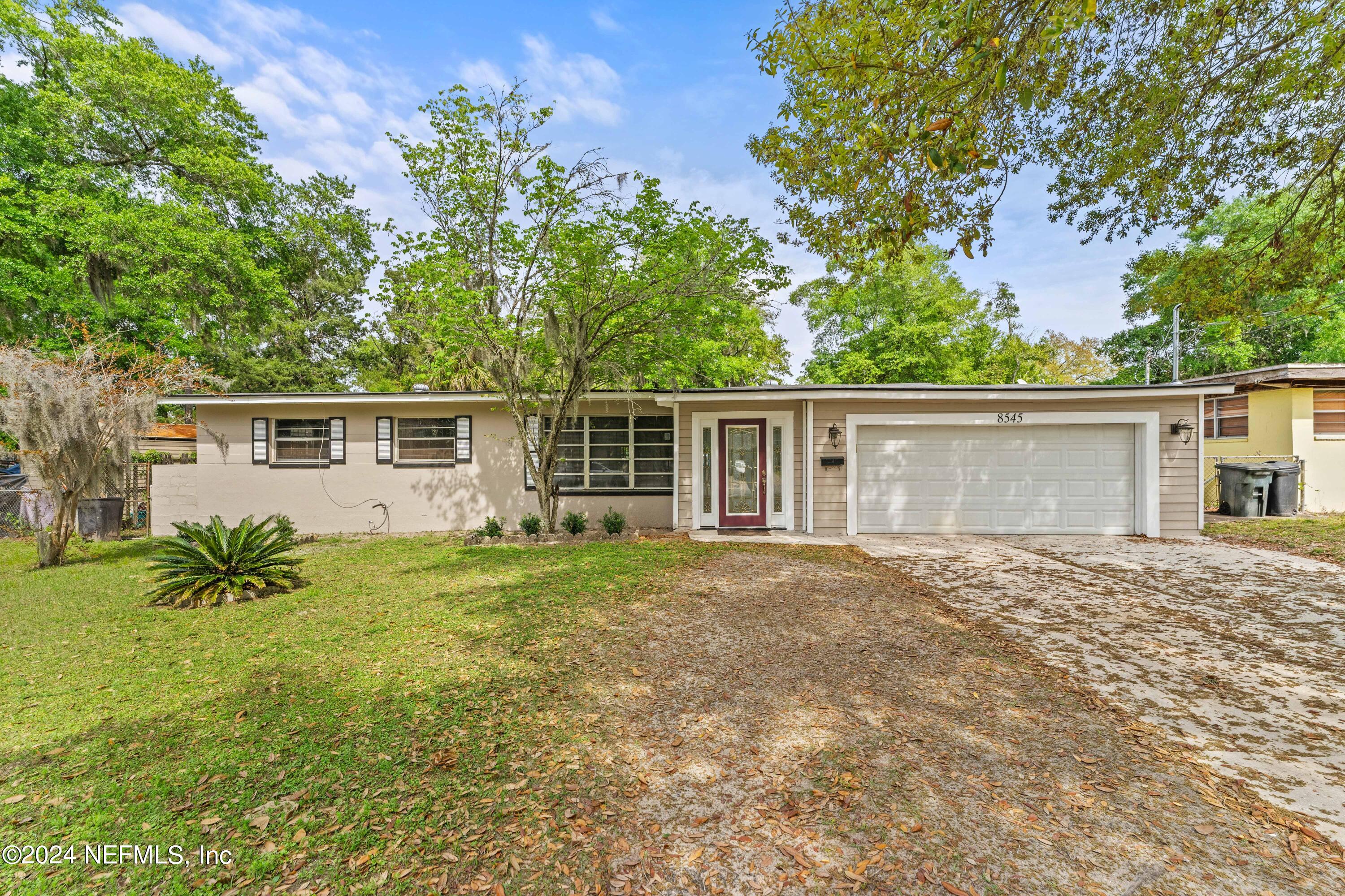 front view of a house with a yard