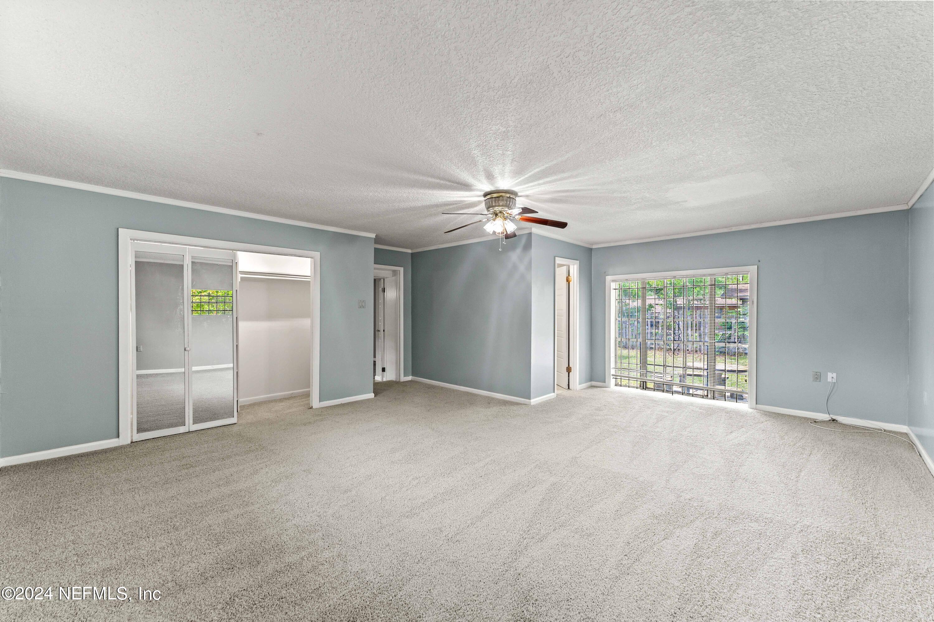 8545 Addison Road Jacksonville, FL 32208 - Photo 11 of 26 a view of an empty room with a window