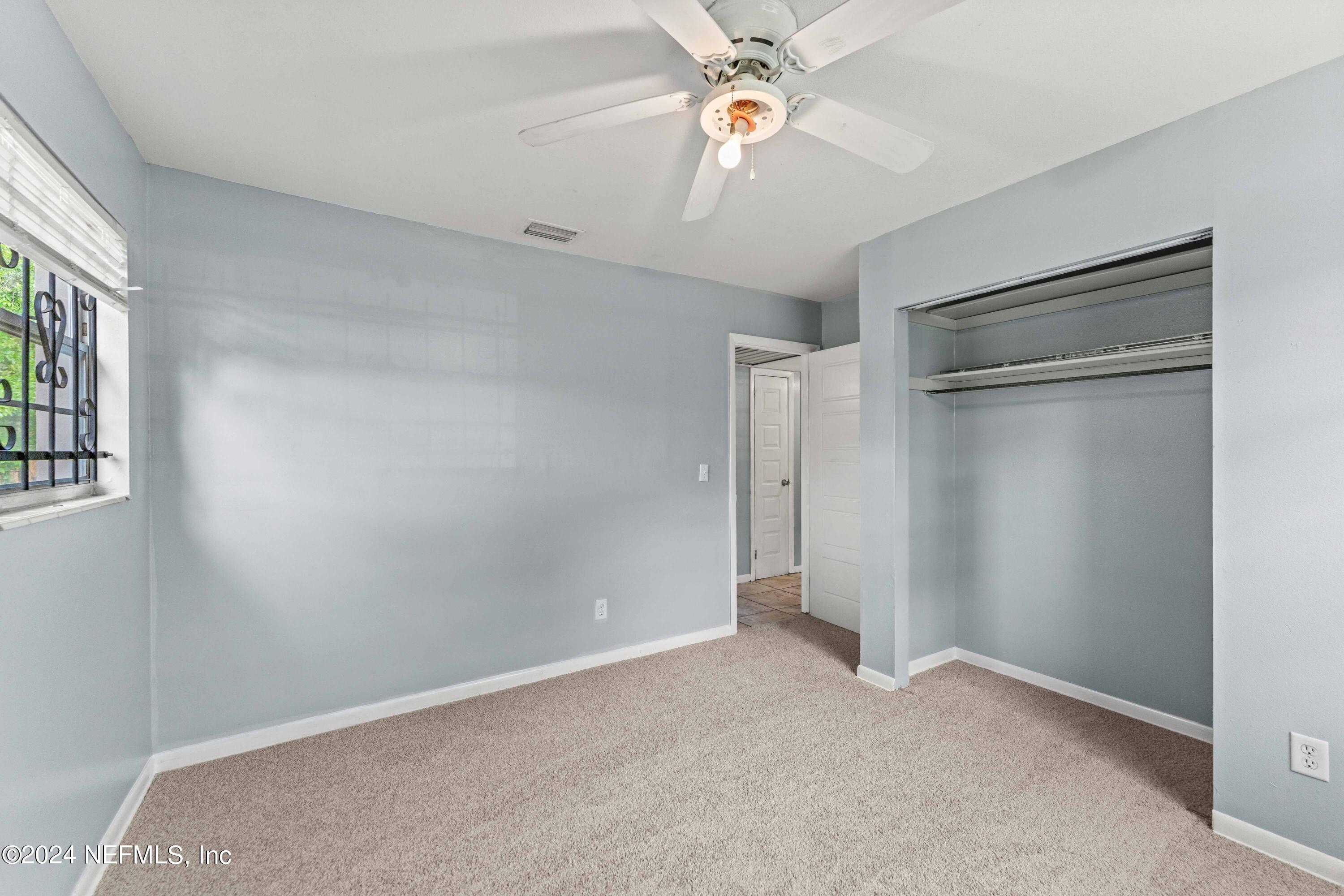 8545 Addison Road Jacksonville, FL 32208 - Photo 17 of 26 a view of an empty room with a window