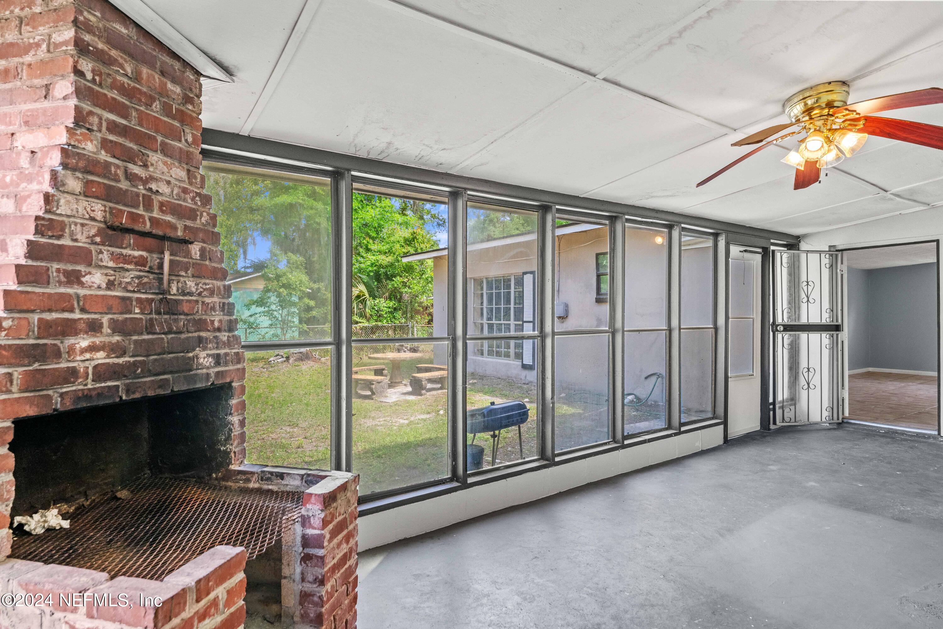 8545 Addison Road Jacksonville, FL 32208 - Photo 21 of 26 a view of a livingroom with an empty space and staircase