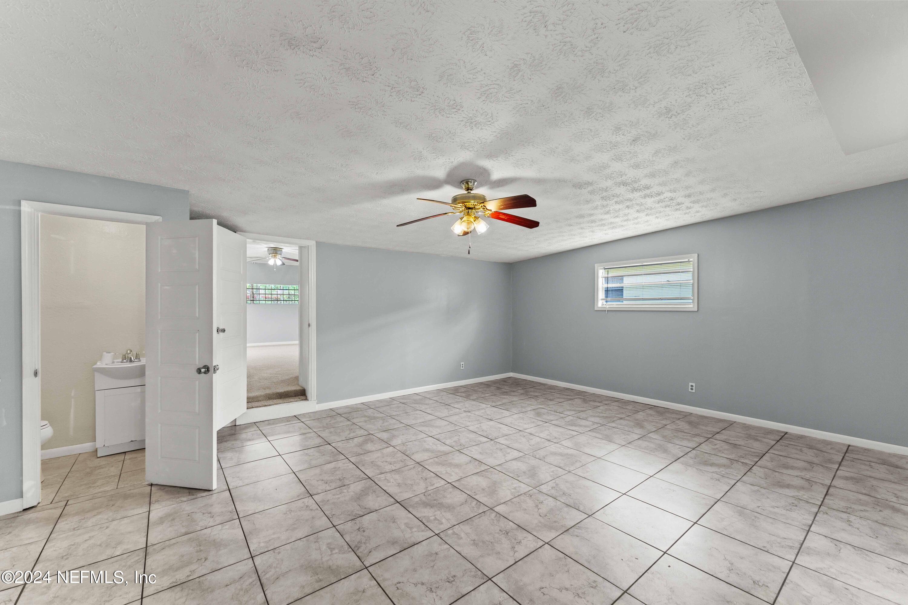 8545 Addison Road Jacksonville, FL 32208 - Photo 7 of 26 a view of an empty room