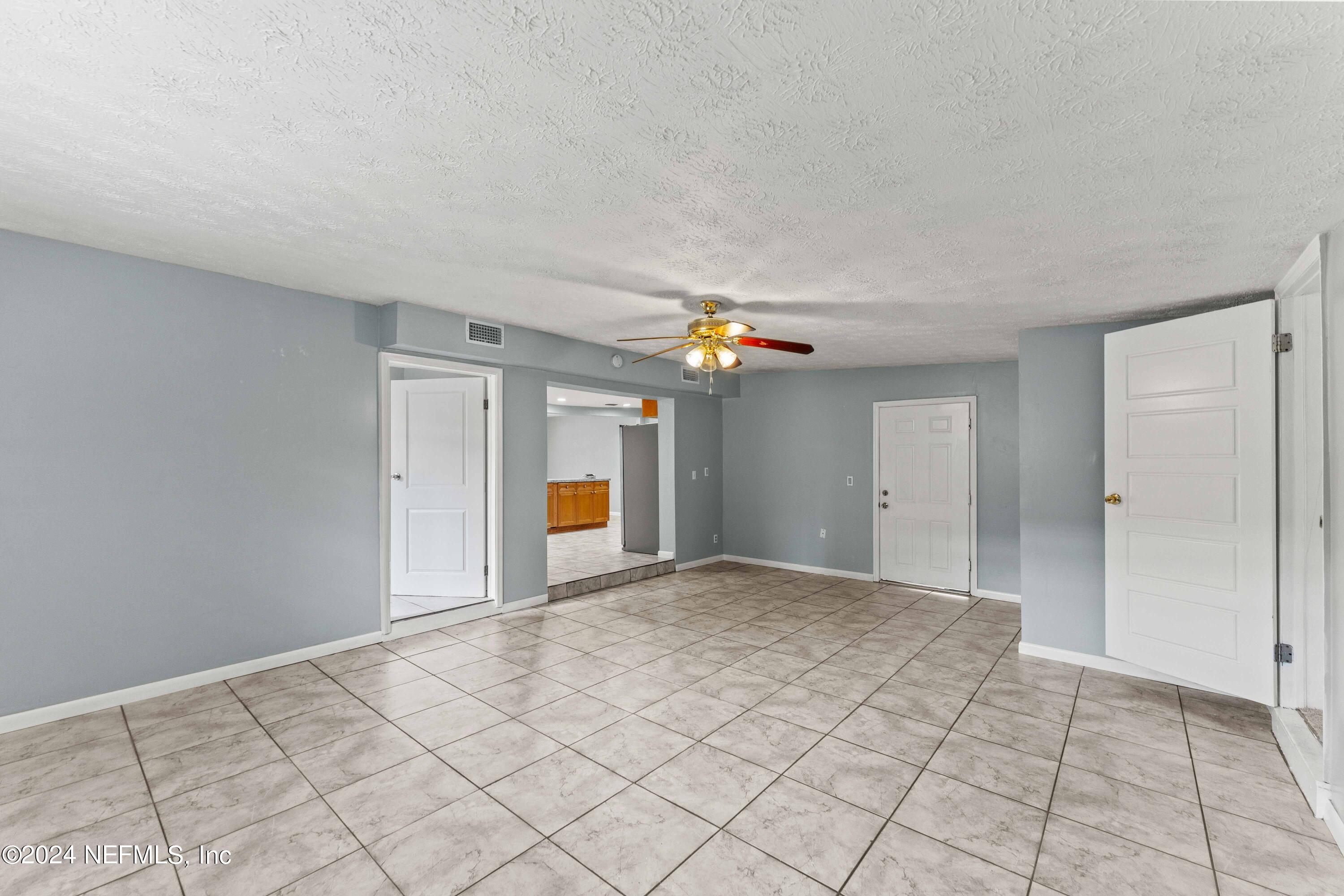 8545 Addison Road Jacksonville, FL 32208 - Photo 8 of 26 a view of an empty room and window