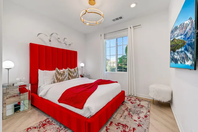 a bedroom with a large bed and a closet