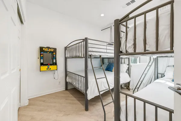 a bedroom with bed and a large window