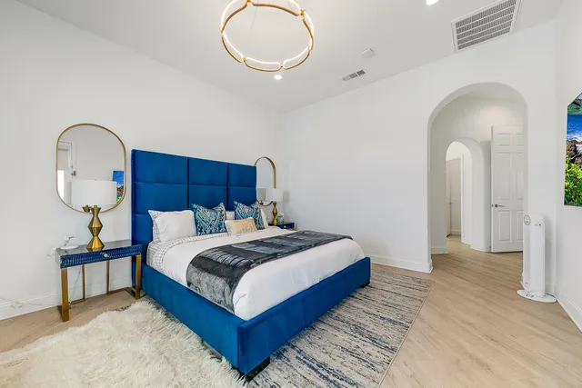 a bathroom with a double vanity sink mirror and shower