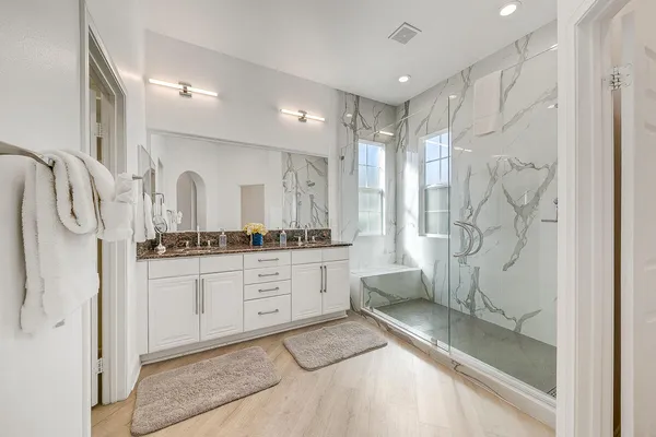 a swimming pool with outdoor seating and lake view