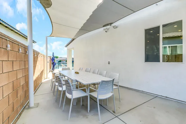 a view of a swimming pool and lounge chair