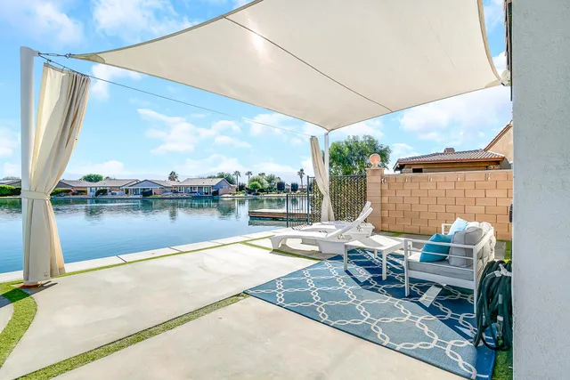 a view of a swimming pool with a patio