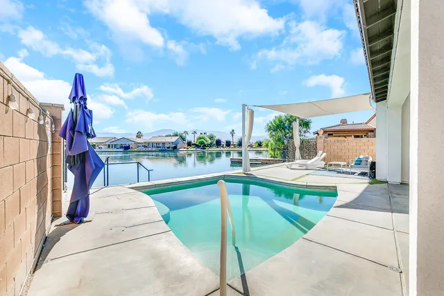 a view of a swimming pool with a patio