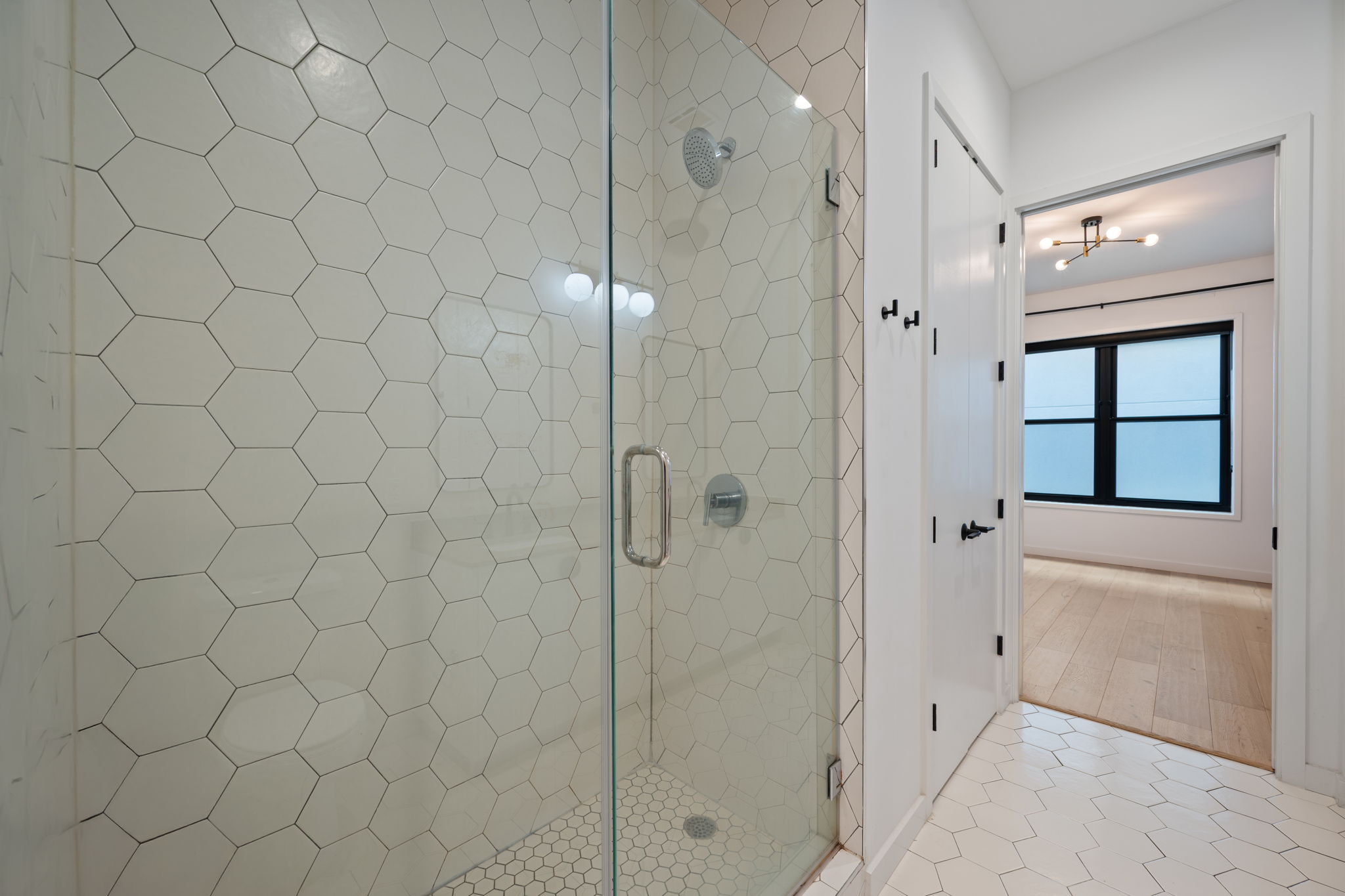 800 Embassy Drive, Unit 322 Austin, TX 78702 - Photo 11 of 31 a bathroom with a shower and a sink