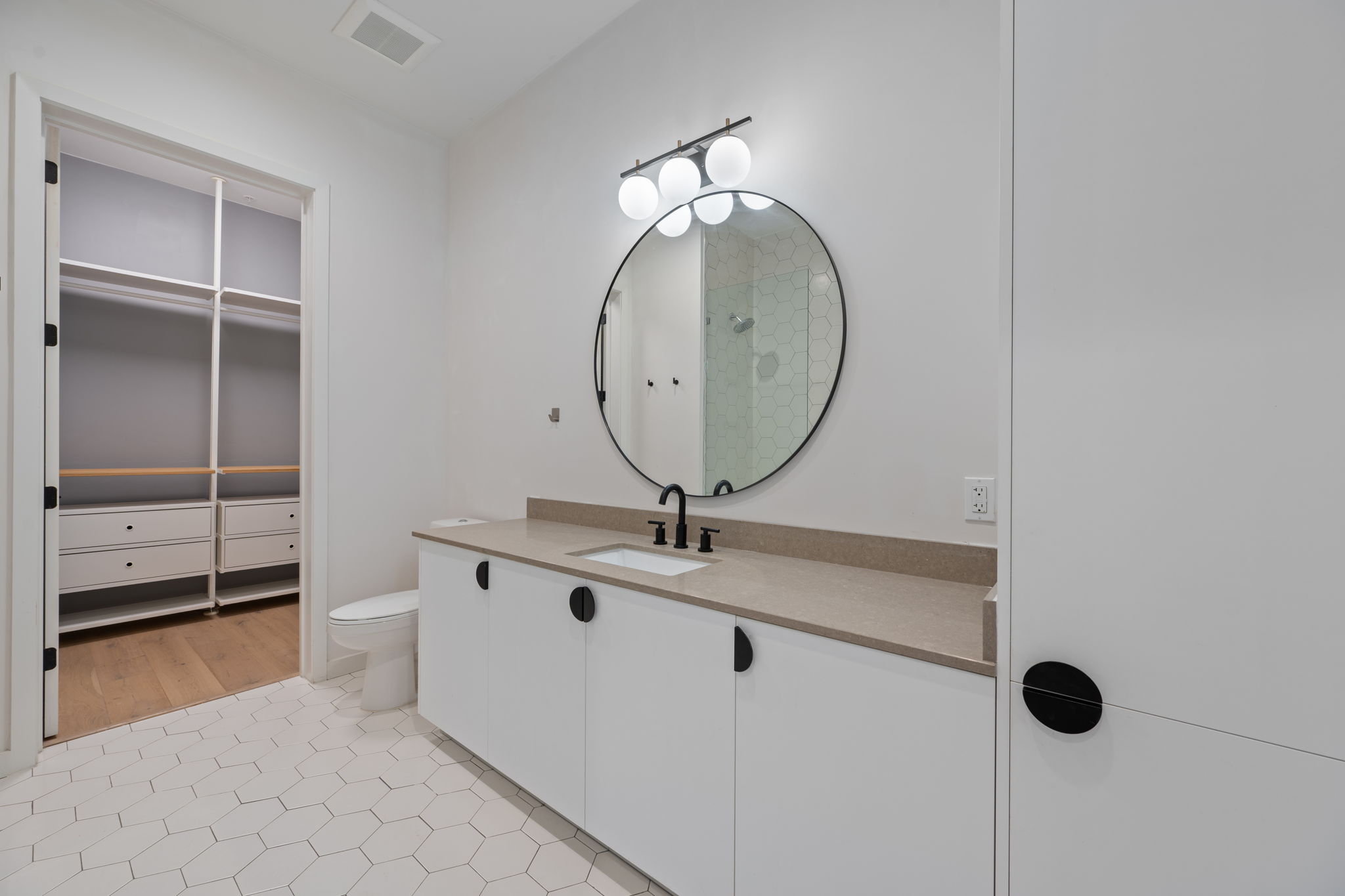 800 Embassy Drive, Unit 322 Austin, TX 78702 - Photo 16 of 31 a room with view of closet and mirror