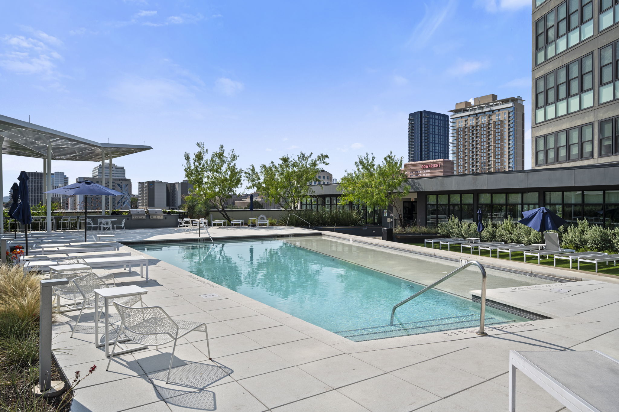 800 Embassy Drive, Unit 322 Austin, TX 78702 - Photo 22 of 31 a view of a swimming pool with a lounge chairs