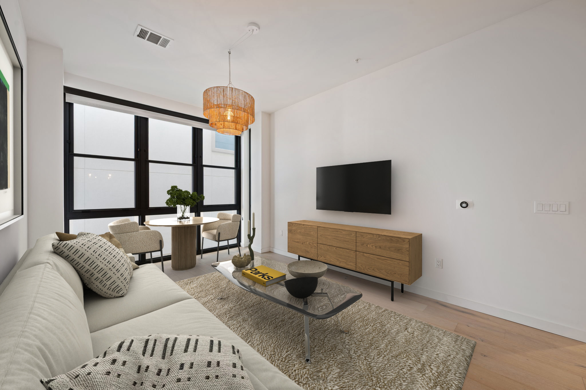 800 Embassy Drive, Unit 322 Austin, TX 78702 - Photo 5 of 31 a living room with furniture and a flat screen tv