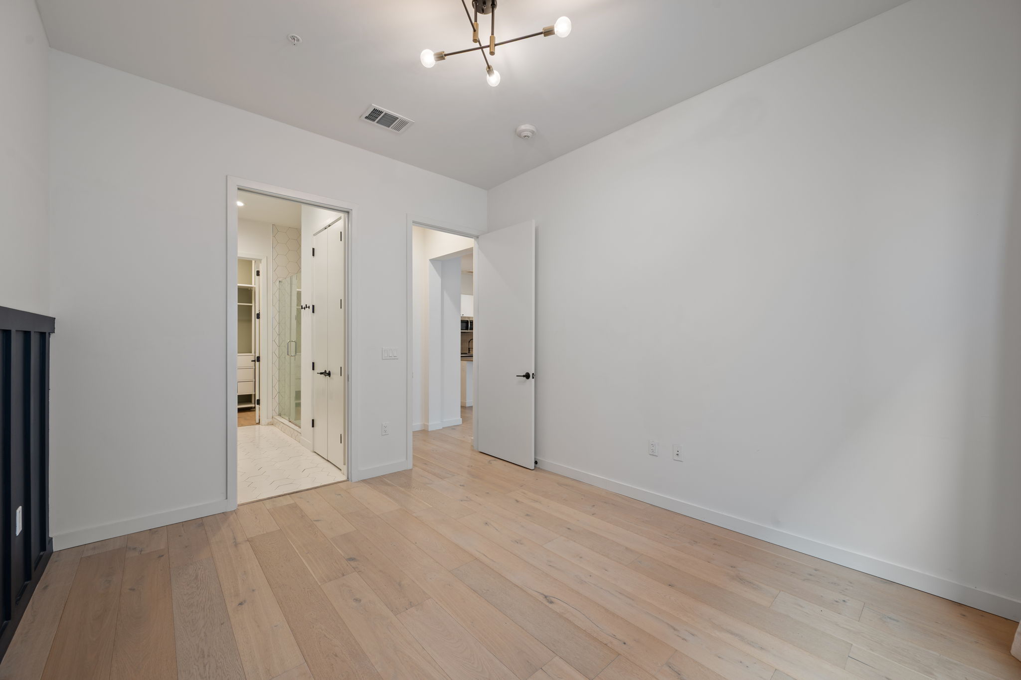 800 Embassy Drive, Unit 322 Austin, TX 78702 - Photo 9 of 31 wooden floor in an empty room