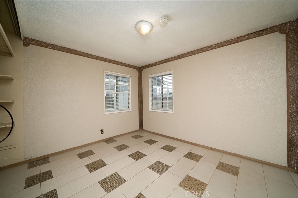 728 Geneva Street Anaheim, CA 92801 - Photo 13 of 24 a view of an empty room with a window