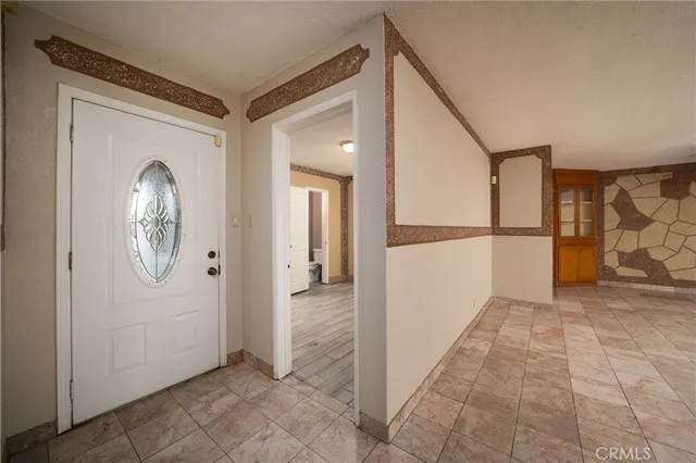a view of empty room with cabinet