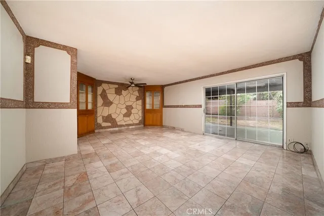 a view of a room with wooden floor and windows
