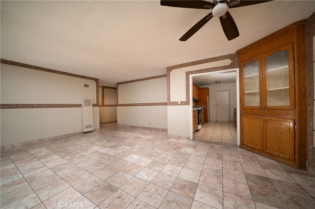 728 Geneva Street Anaheim, CA 92801 - Photo 7 of 24 a view of a room with wooden floor and windows