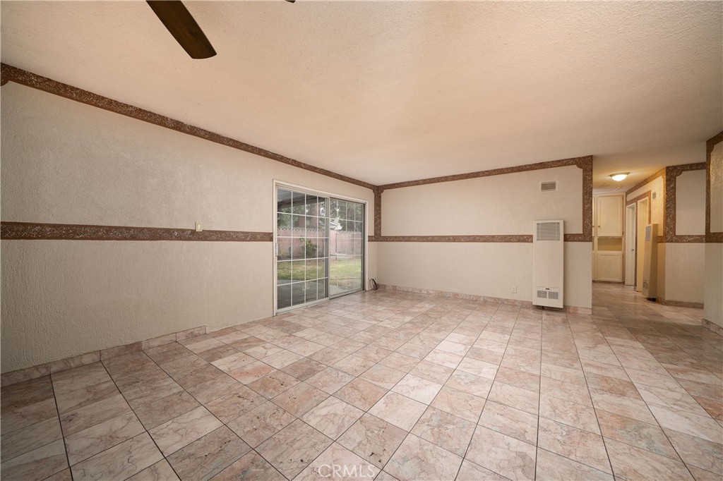 728 Geneva Street Anaheim, CA 92801 - Photo 8 of 24 a view of a big room with a refrigerator