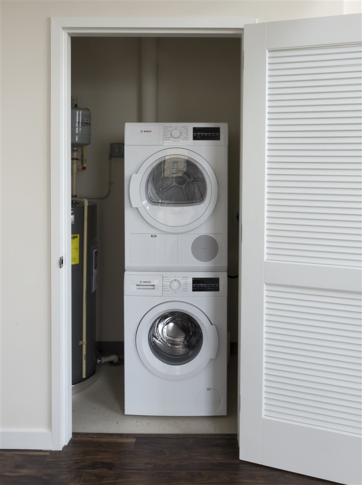 88 Clifton Place, Unit 201 Jersey City, NJ 07304 - Photo 6 of 10 a utility room with dryer and washer