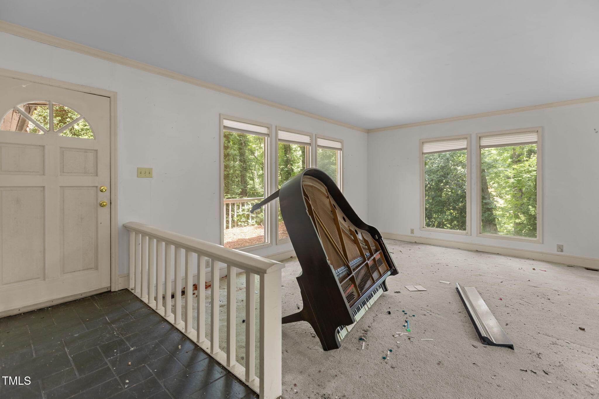 1409 Trailwood Drive Raleigh, NC 27606 - Photo 17 of 32 a view of a hallway with windows