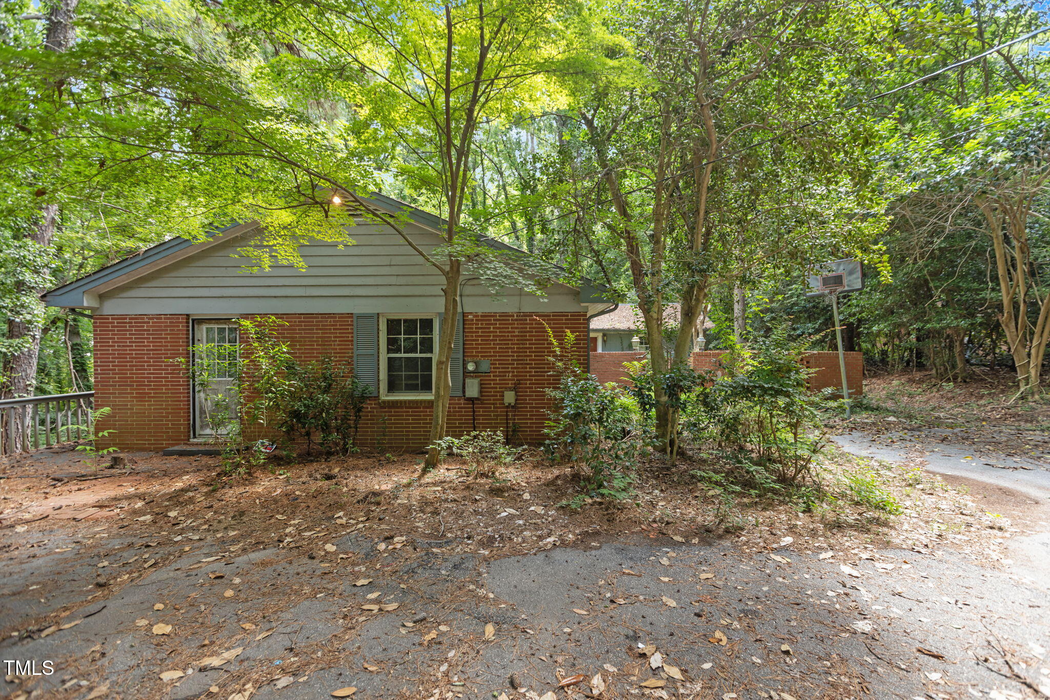 1409 Trailwood Drive Raleigh, NC 27606 - Photo 3 of 32 a front view of a house with garden