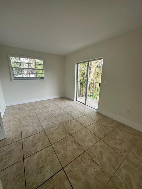Undisclosed Address Miami, FL 33128 - Photo 15 of 23 an empty room with windows