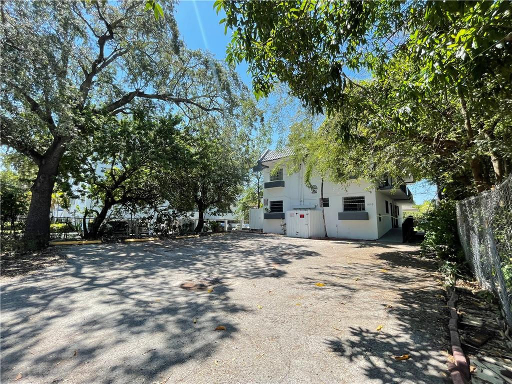 Undisclosed Address Miami, FL 33128 - Photo 4 of 23 a tree is standing in front of a house