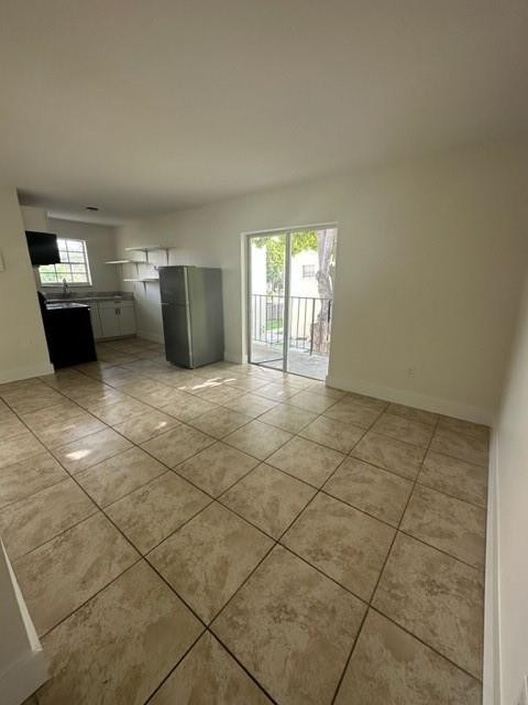 Undisclosed Address Miami, FL 33128 - Photo 8 of 23 a view of a kitchen with furniture and an empty room