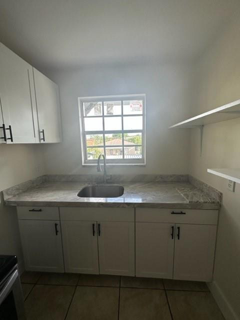 Undisclosed Address Miami, FL 33128 - Photo 10 of 23 a kitchen with a sink cabinets and window
