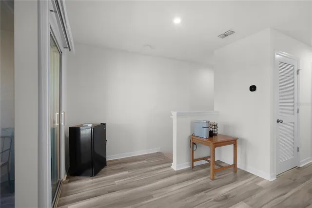 a bedroom with a bed and a desk