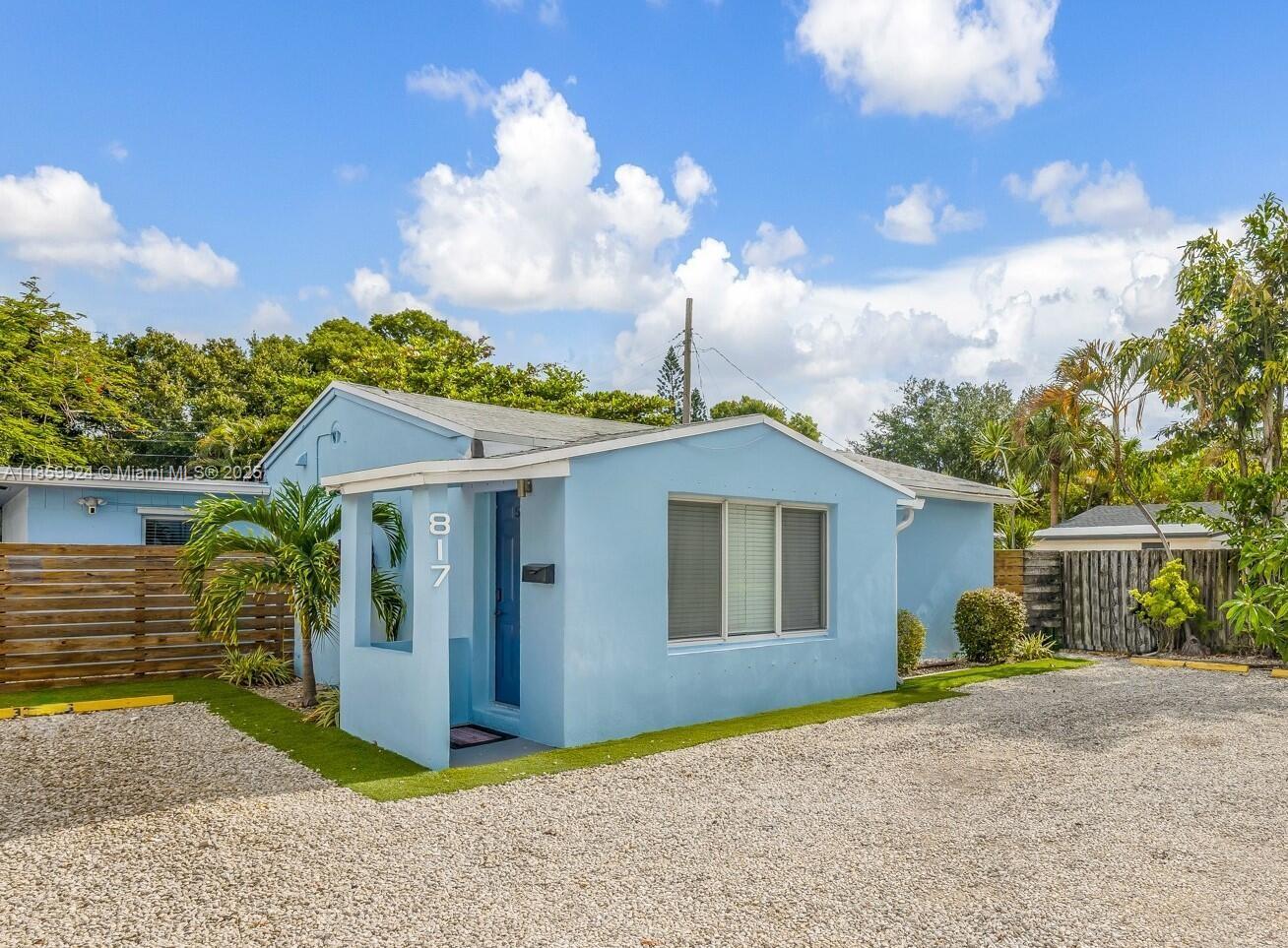 817 Southwest 12th Avenue Fort Lauderdale, FL 33315 - Photo 1 of 37 a front view of a house with garden