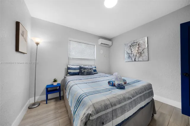 a bedroom with bed and window