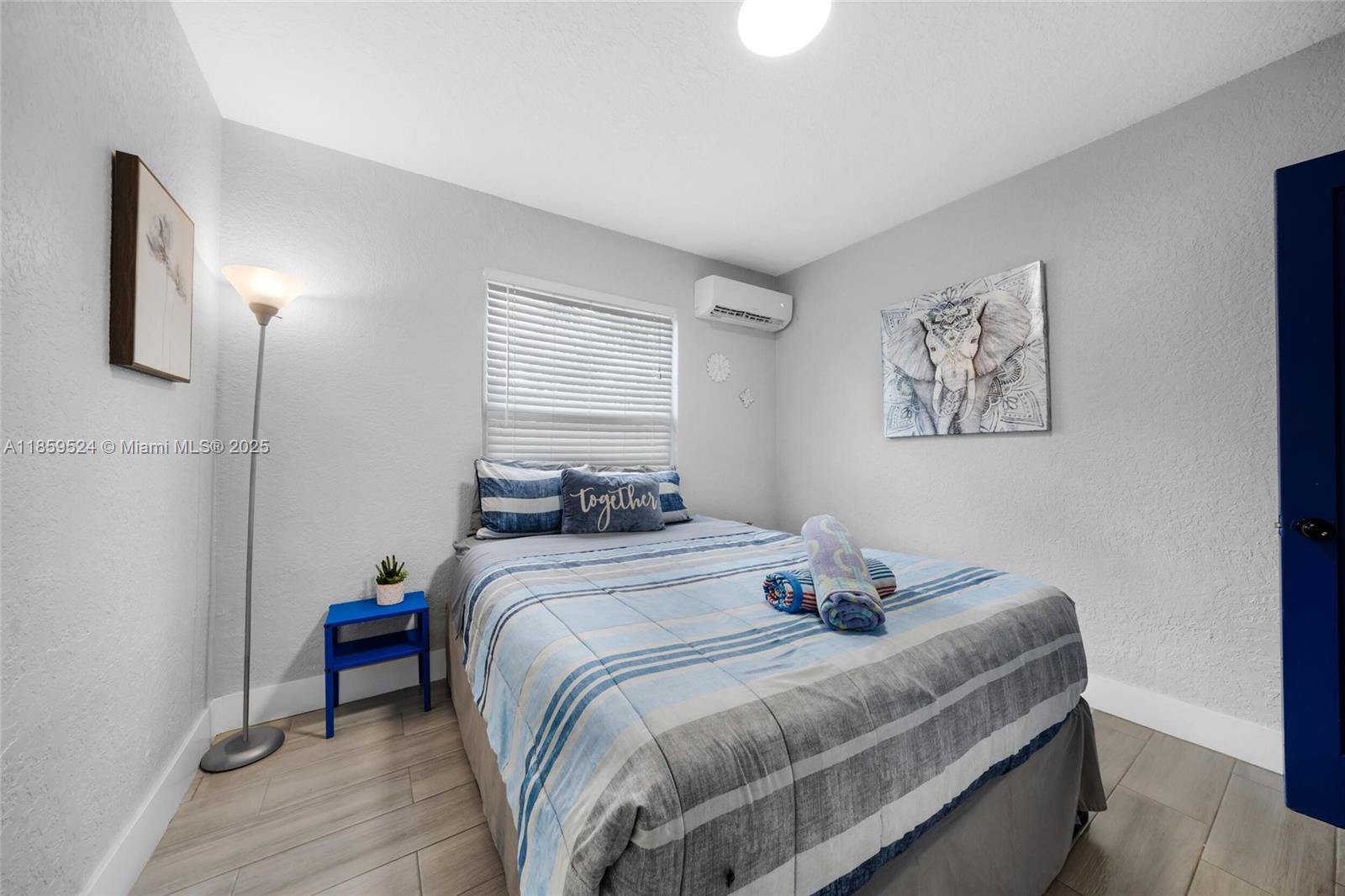 817 Southwest 12th Avenue Fort Lauderdale, FL 33315 - Photo 18 of 37 a bedroom with bed and window