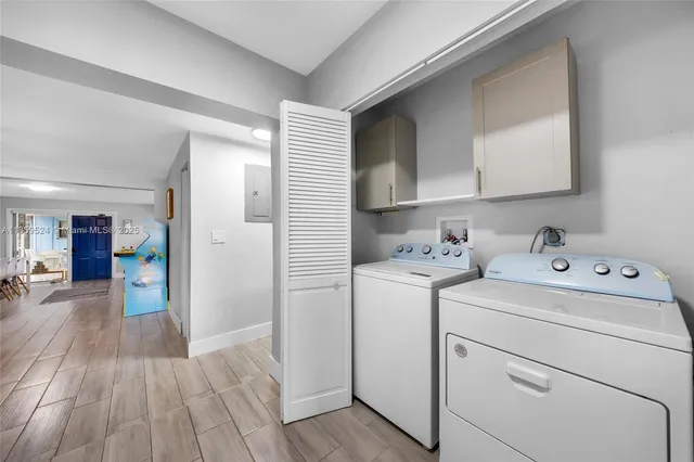 a view of storage and utility room with washer and dryer