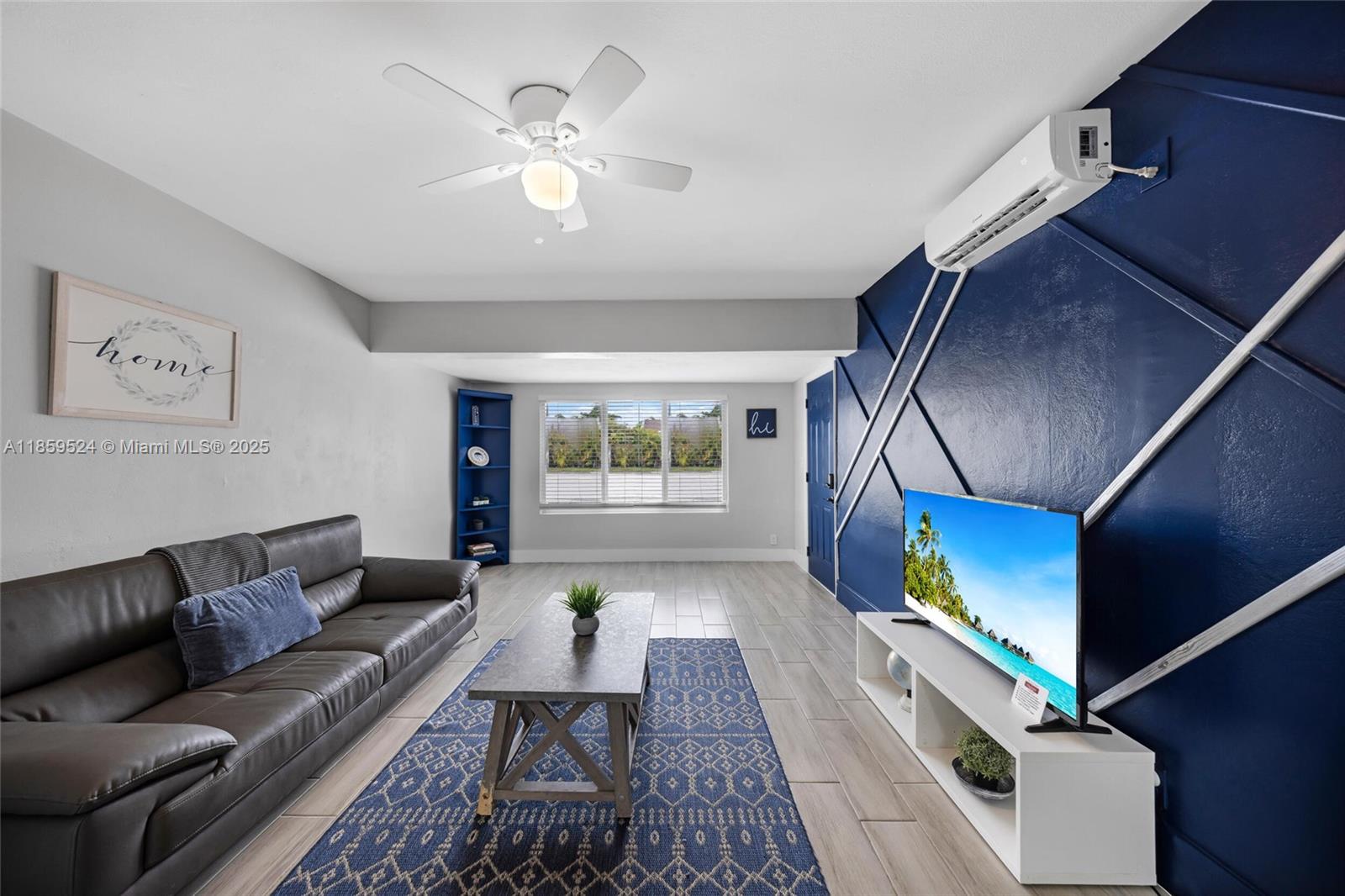 817 Southwest 12th Avenue Fort Lauderdale, FL 33315 - Photo 24 of 37 a living room with furniture and a fireplace