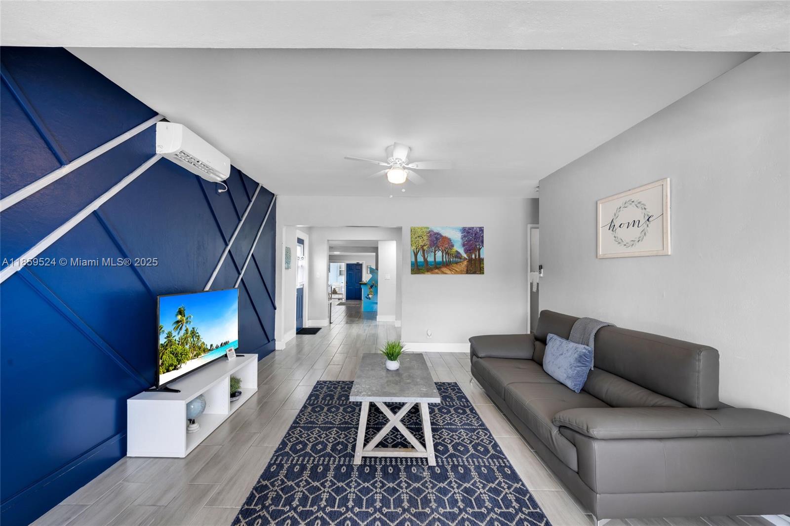 817 Southwest 12th Avenue Fort Lauderdale, FL 33315 - Photo 25 of 37 a living room with furniture and a rug