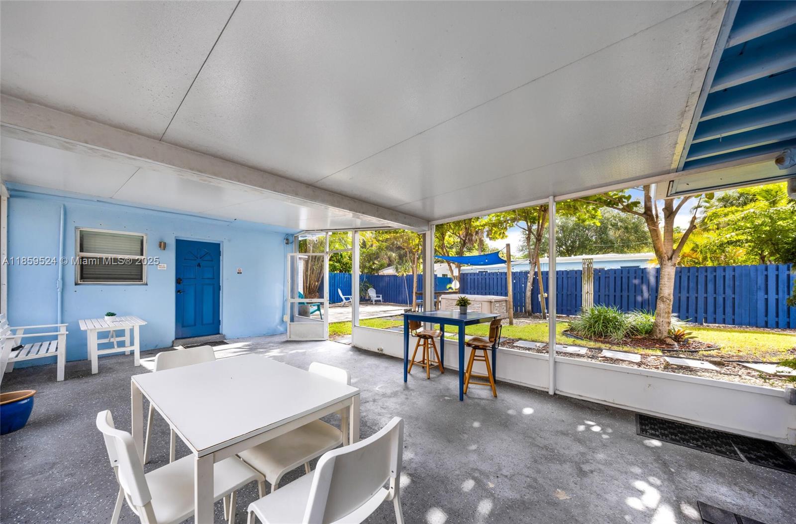 817 Southwest 12th Avenue Fort Lauderdale, FL 33315 - Photo 31 of 37 a view of a dining table and chairs in the patio