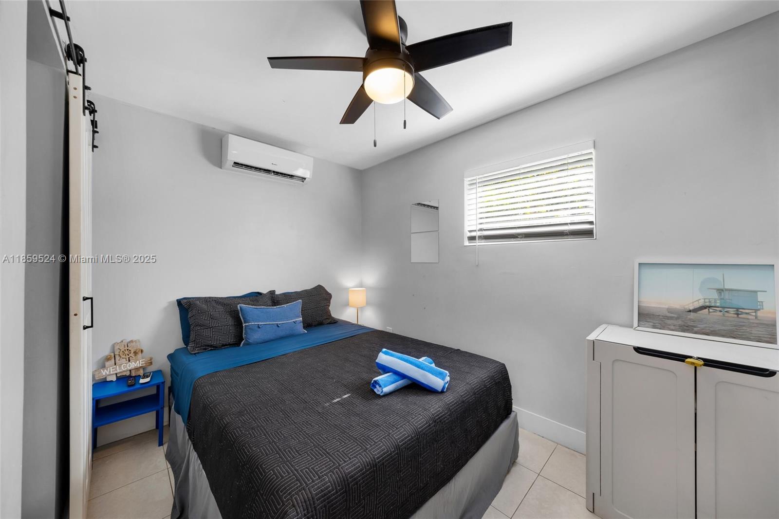 817 Southwest 12th Avenue Fort Lauderdale, FL 33315 - Photo 34 of 37 a bedroom with bed and a window