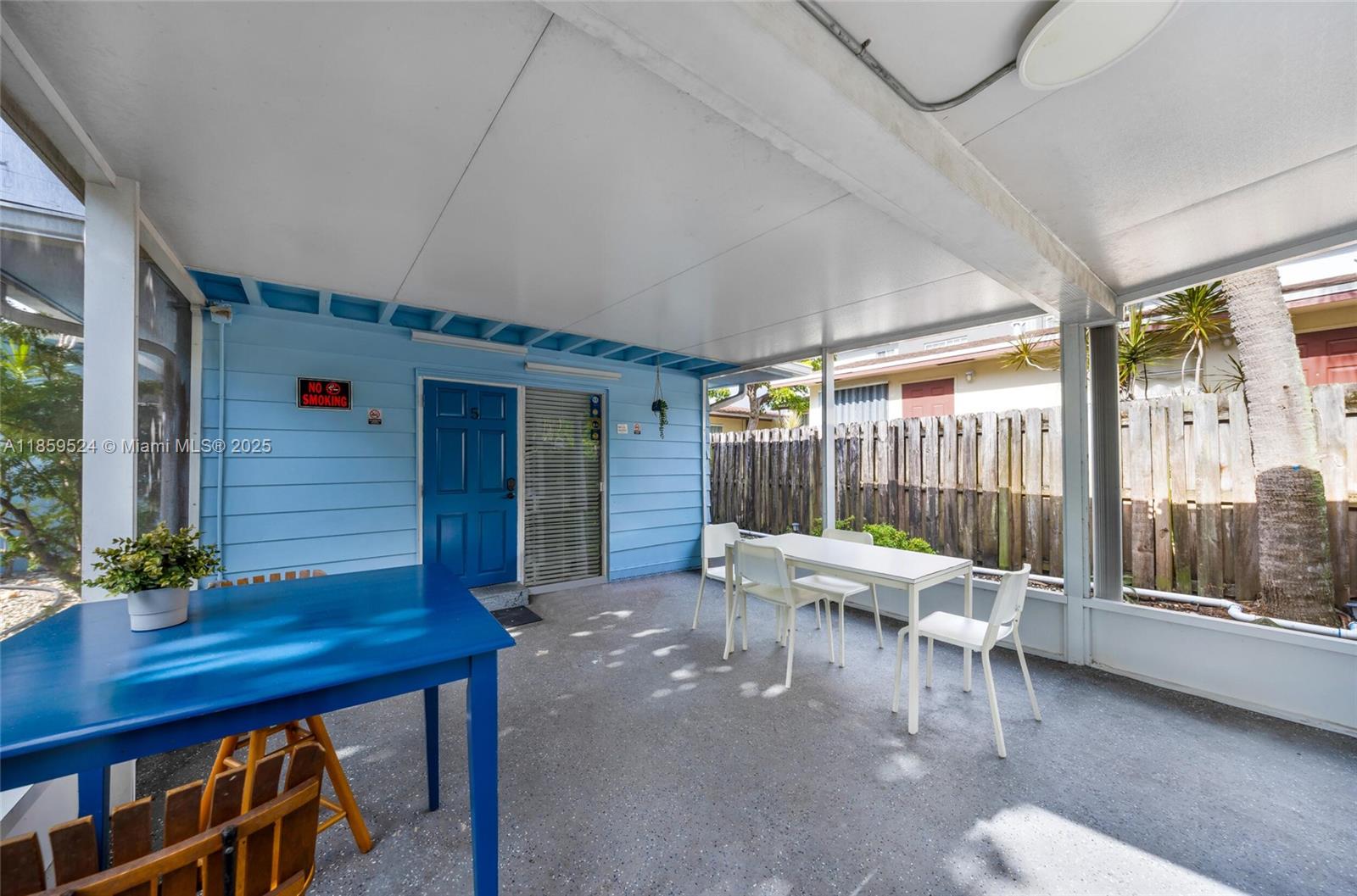 817 Southwest 12th Avenue Fort Lauderdale, FL 33315 - Photo 6 of 37 a living room with furniture a table and a large window