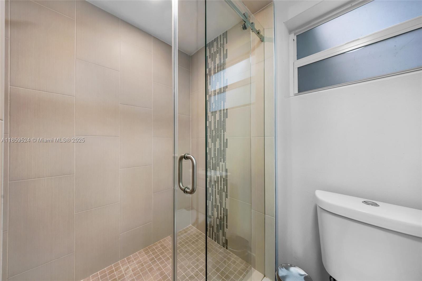 817 Southwest 12th Avenue Fort Lauderdale, FL 33315 - Photo 8 of 37 a bathroom with a shower and toilet