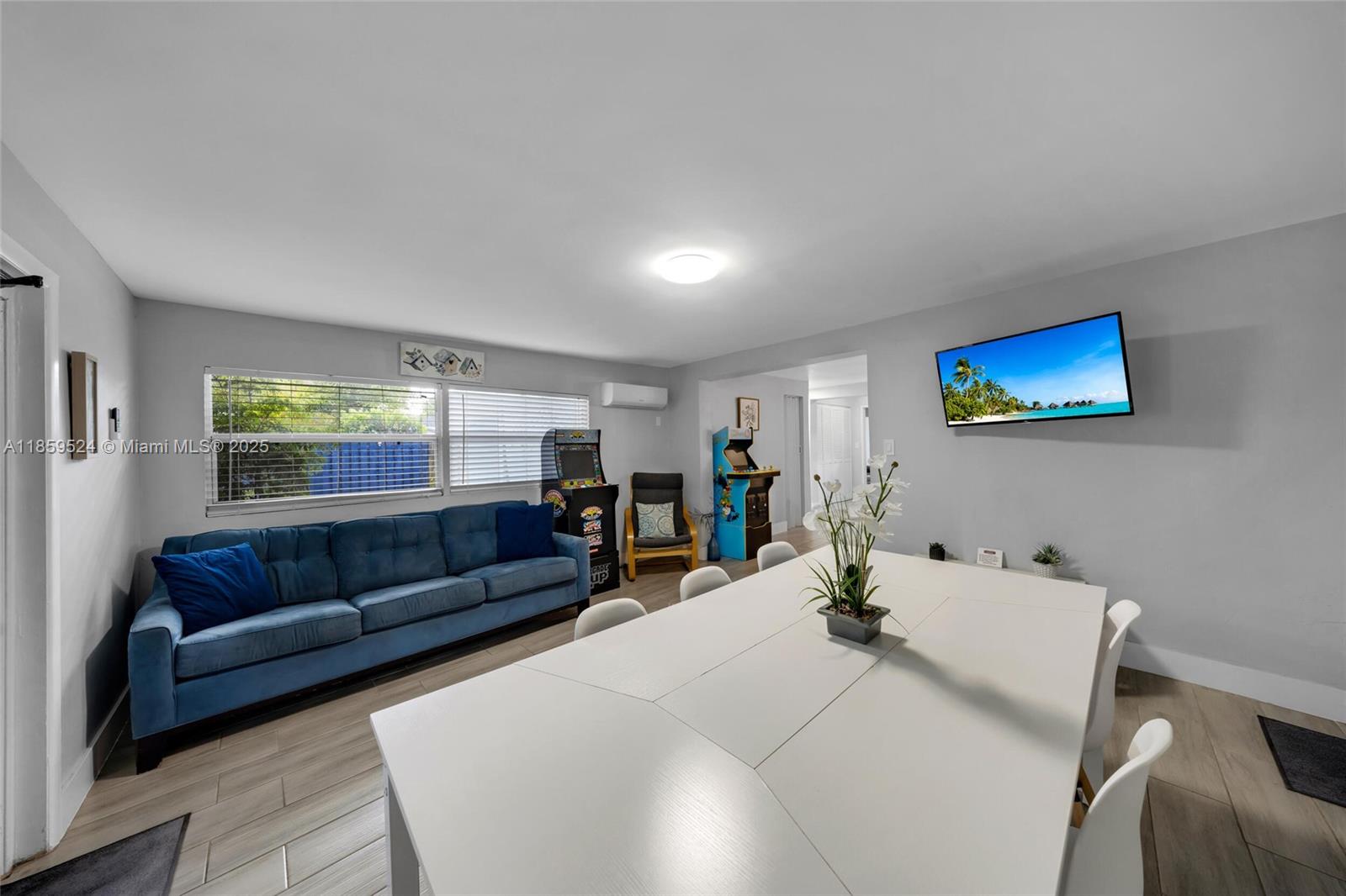 817 Southwest 12th Avenue Fort Lauderdale, FL 33315 - Photo 9 of 37 a living room with furniture and a flat screen tv