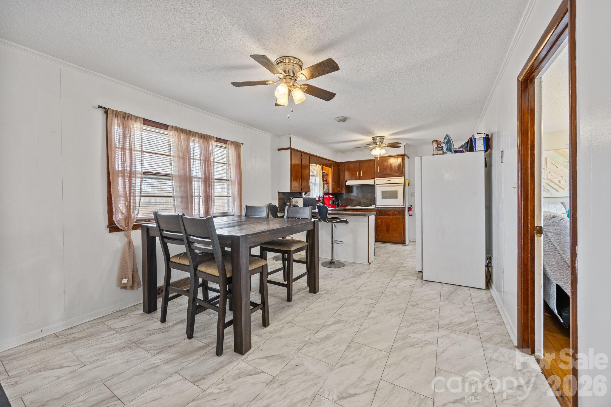 289 Washington Park Road Mount Gilead, NC 27306 - Photo 26 of 39 a view of a dining room with furniture and window