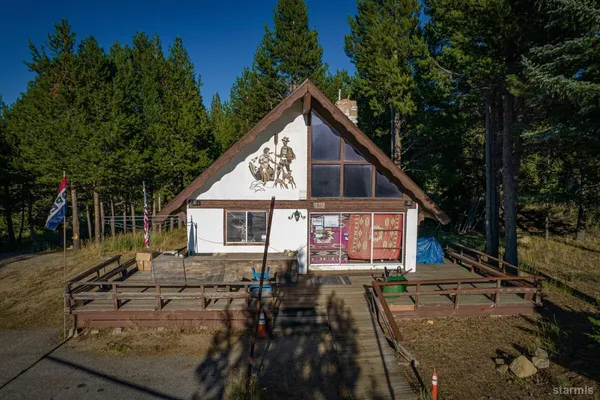 a view of house with outdoor seating area