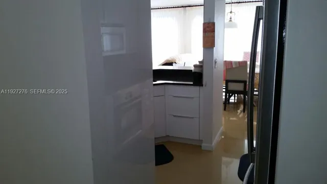 a kitchen with a stove and a microwave