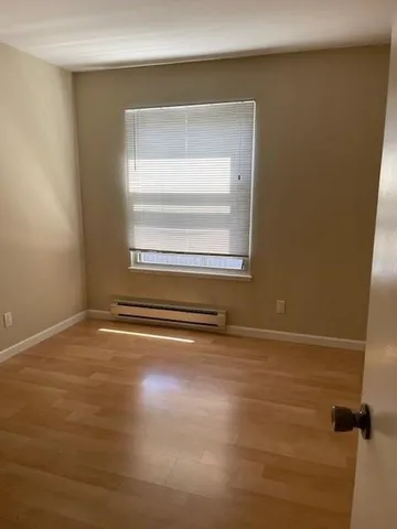 a view of a swimming pool with a yard and mountain view