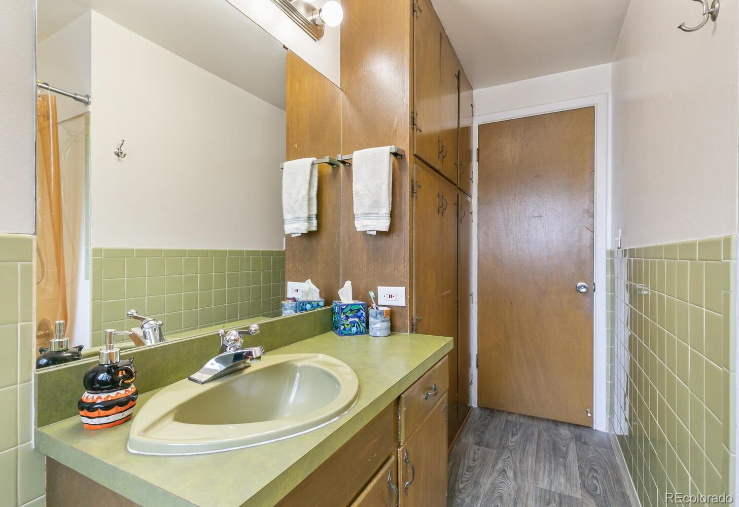 3820 Xavier Street Denver, CO 80212 - Photo 13 of 35 a bathroom with a sink and a mirror