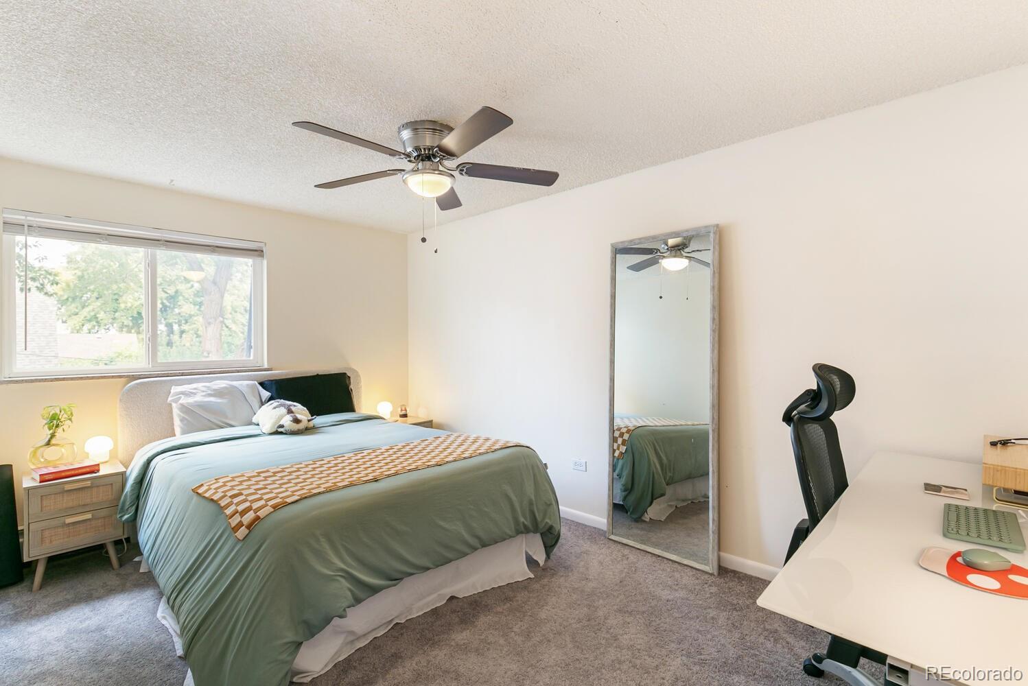 3820 Xavier Street Denver, CO 80212 - Photo 24 of 35 a bedroom with a bed and a window